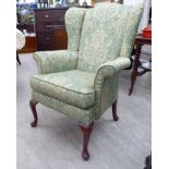 A modern Parker Knoll wingback armchair,