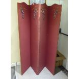 A 1930s maroon fabric covered four-fold dressing room screen with embroidered floral ornament
