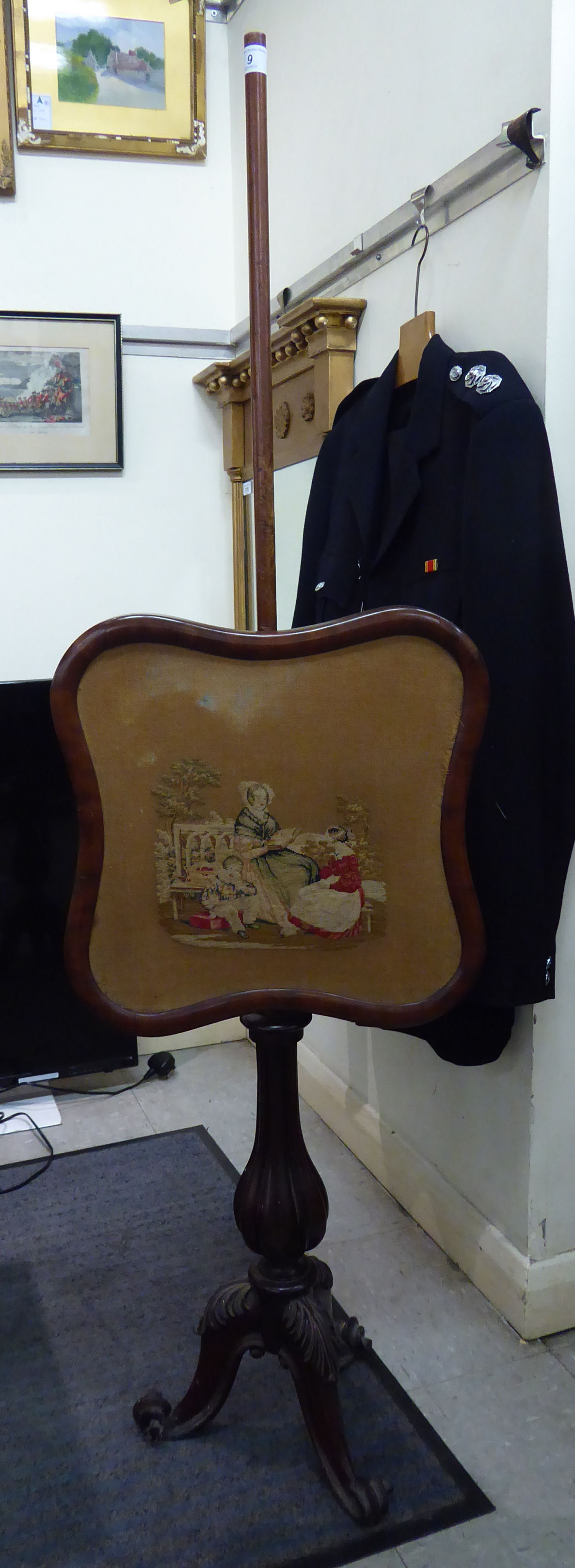 A William IV mahogany polescreen, set with a height adjustable pictorial tapestry panel,