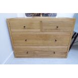 A modern Heals light oak four drawer dressing chest,