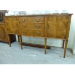 A modern yewwood serpentine front sideboard with three drawers/two doors, raised on square,
