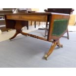 A modern mahogany coffee table, the top set with a green hide scriber,