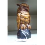 An early/mid 20thC Black Forest painted and carved softwood novelty inkwell, fashioned as an owl 5.