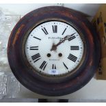 An early 20thC stained pine cased wall clock; the movement faced by a glass Roman dial,