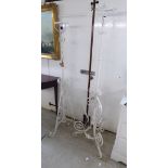 Two similar 20thC white painted wrought iron standard lamps 52'' & 55''h BSR