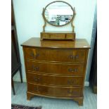 A modern yewwood bow front four drawer dressing chest,