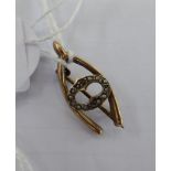 A late Victorian 9ct gold wishbone brooch,