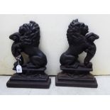 A pair of late Victorian cast iron door porters,