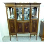 An Edwardian satinwood inlaid mahogany display cabinet with two central astragal glazed doors,