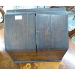 A late Victorian oak table top stationary cabinet with a double hinged front,