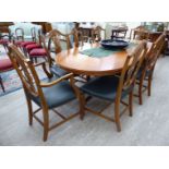 A modern Regency style yewwood twin pedestal dining table,