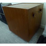 A 1960s/70s Danish teak cocktail cabinet, the hinged front opening to reveal a fitted interior,
