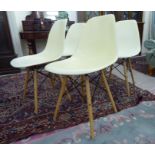 A set of four Eames Eiffel design cream painted plastic tub chairs,