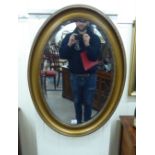 A late 19thC bevelled mirror,