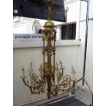 A mid 20thC Dutch gilt metal eight branch chandelier with scrolled ornament 49'''drop 26''spread