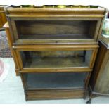 A 1920s stained oak Globe Wernicke three tier bookcase,