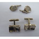 A pair of silver cufflinks,