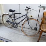 A lady's mid 20thC grey painted metal framed BSA Metro bicycle with 28'' wheels BSR