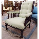 A late Victorian mahogany framed salon chair, upholstered in a pale green fabric, raised on turned,