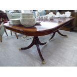 A modern Regency style mahogany dining table, the top with a crossbanded satinwood border,