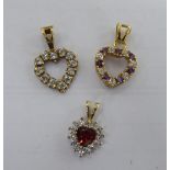 Three 9ct gold heart shaped pendants,