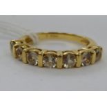 An 18ct gold half-eternity ring,