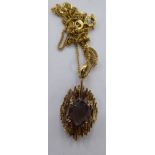 A 9ct gold pendant and chain,