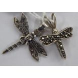 Two similar silver dragonfly design pendants 11
