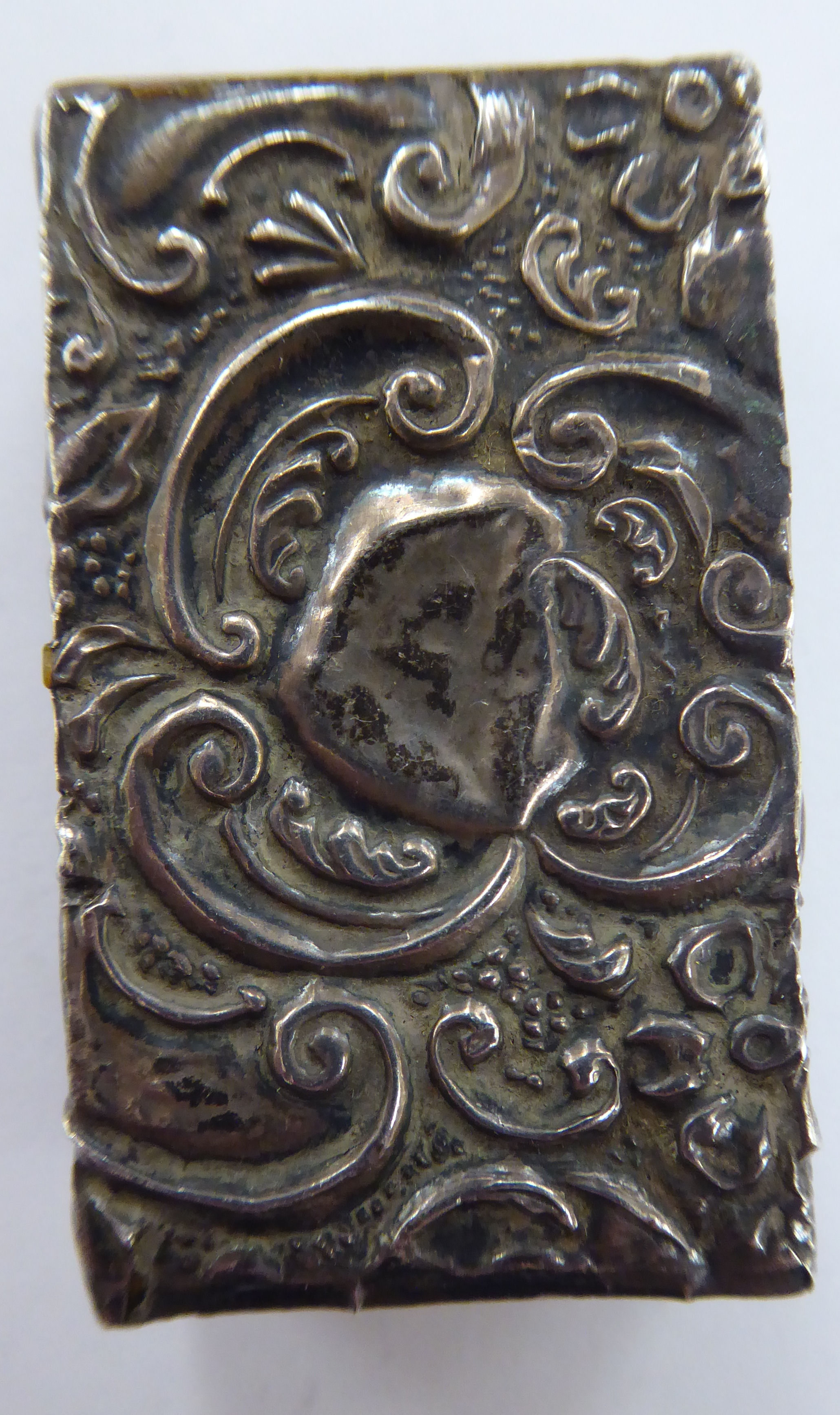A Continental silver coloured metal vesta case, embossed with flora and scrolls, - Image 3 of 6