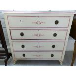 A 1930s cream painted and stencilled four drawer dressing chest,