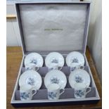 A set of six Royal Worcester bone china coffee cans and saucers,