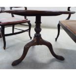 A George III and later mahogany pedestal table with a carved top,