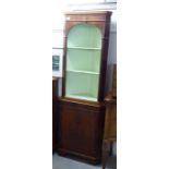 A modern Georgian style yew wood corner cabinet with two open shelves, over a panelled door,