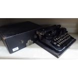 An early 20thC Underwood portable typewriter,