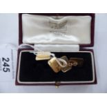 A pair of 9ct gold engine turned and engraved tablet and chain cufflinks 11