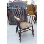 A late 19thC beech and elm framed Windsor high lath back elbow chair,