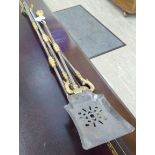 A set of three 19thC polished steel and brass fire irons with ring knopped handles comprising a