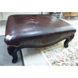 A Ralph Lauren stud-upholstered brown hide footstool,