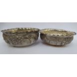 A pair of Dass & Dutt Indian silver coloured metal oval sweet dishes with crimped rims,