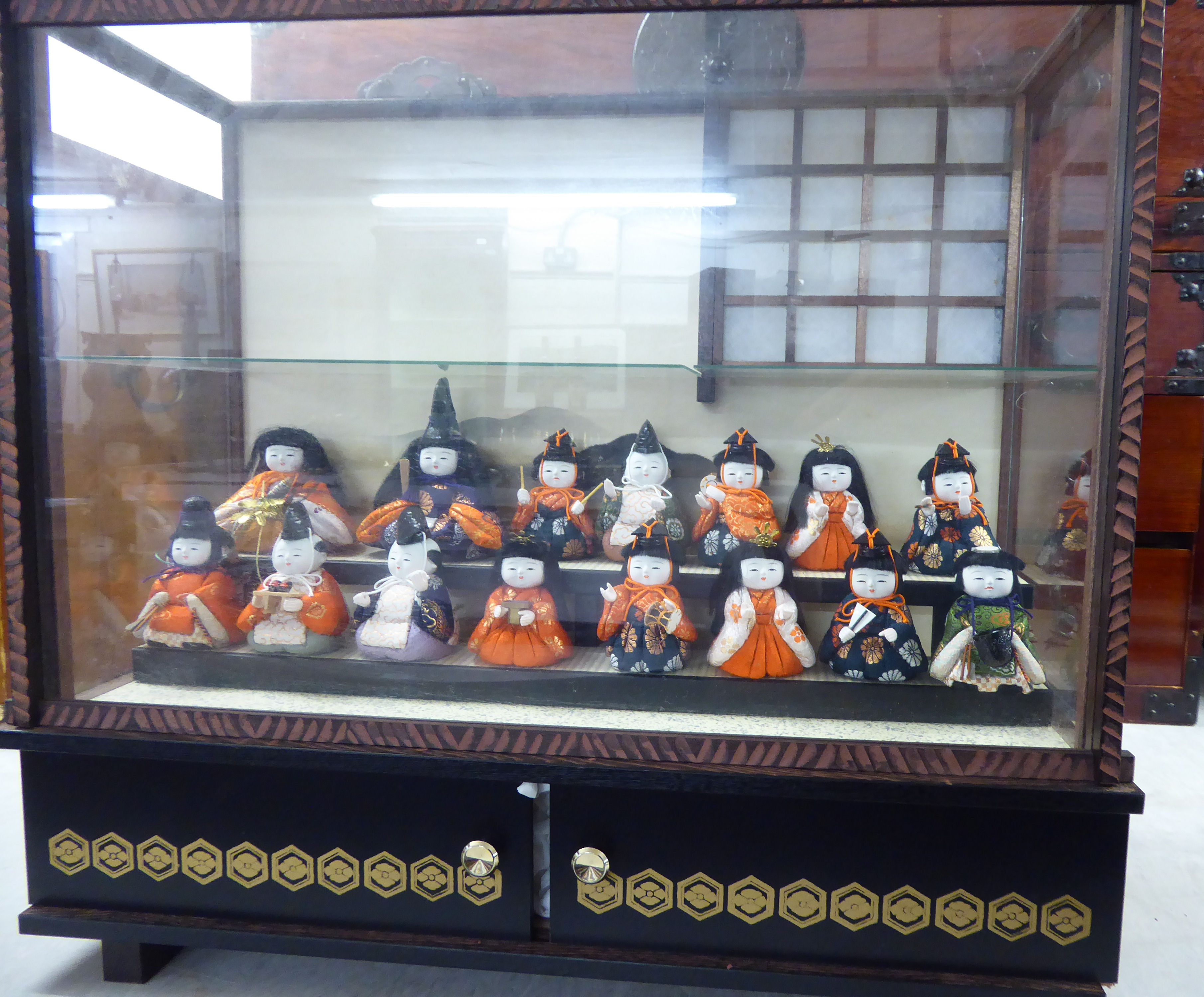 A collection of fifteen modern fabric covered Japanese miniature dolls,