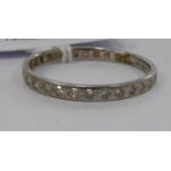 A platinum and diamond set eternity ring 11