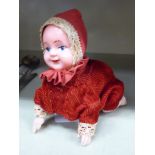 A mid 20thC clockwork toy, a crawling baby,