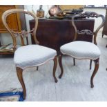 Two similar mid Victorian rosewood and walnut framed balloon and bar back bedroom chairs,