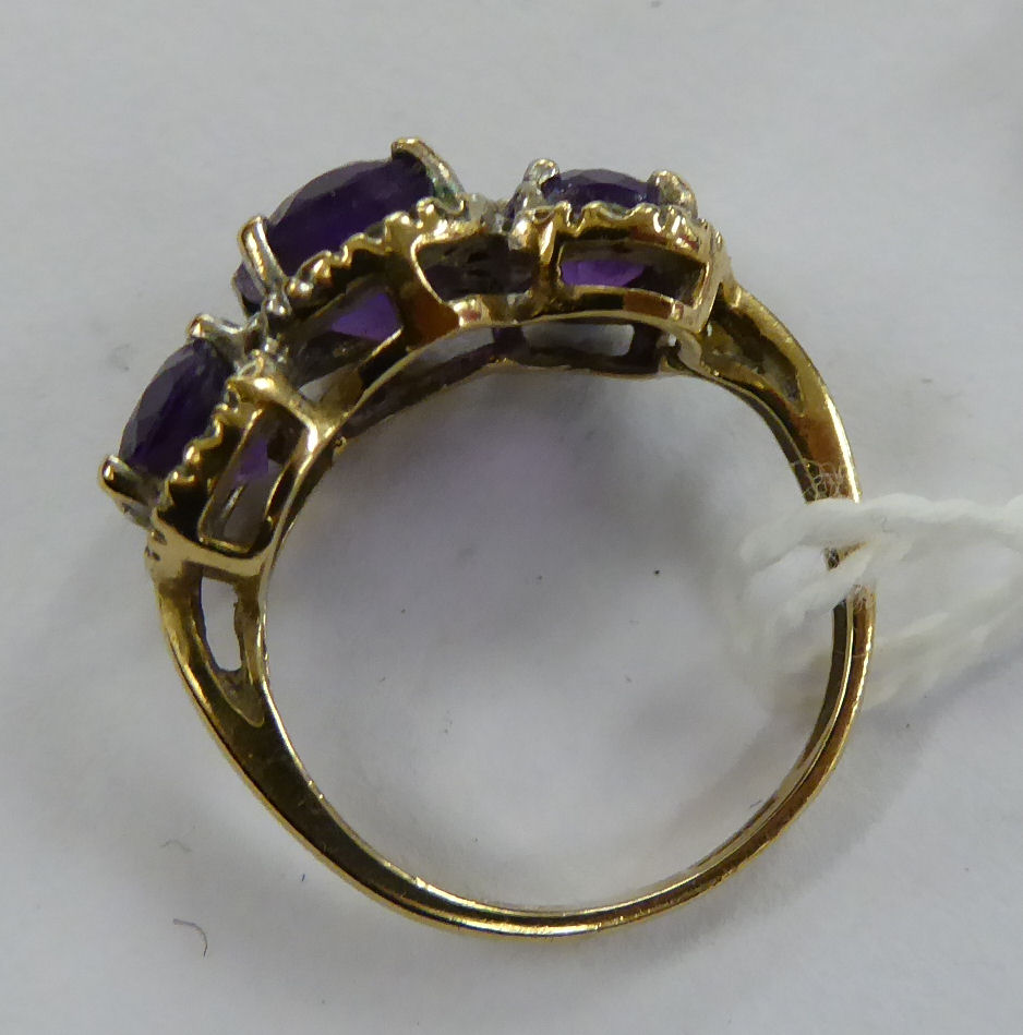 A 9ct gold three stone claw set amethyst and diamond ring 11 - Image 2 of 2