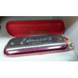 An M Hohner Educator II harmonica cased OS2