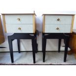 A pair of 1970s light oak and black painted, two drawer bedside chests,
