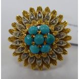 An 18ct gold turquoise and diamond set cluster ring 11