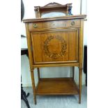 An early 20thC Continental satin mahogany cabinet with a low galleried upstand,