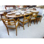 A modern Regency style yew wood twin pedestal dining table,