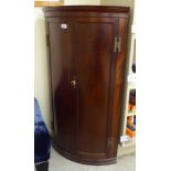 A modern mahogany corner cupboard with twin doors and brass butterfly hinges 39''h 22''w F